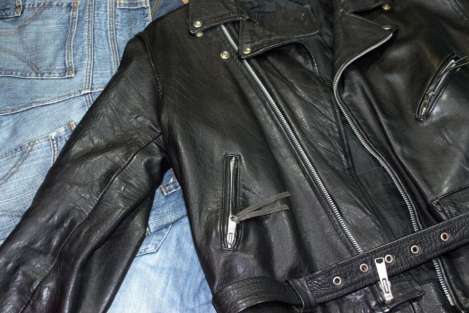 Leather jacket maintenance and care essentials, including cleaning, conditioning, and storage tips.